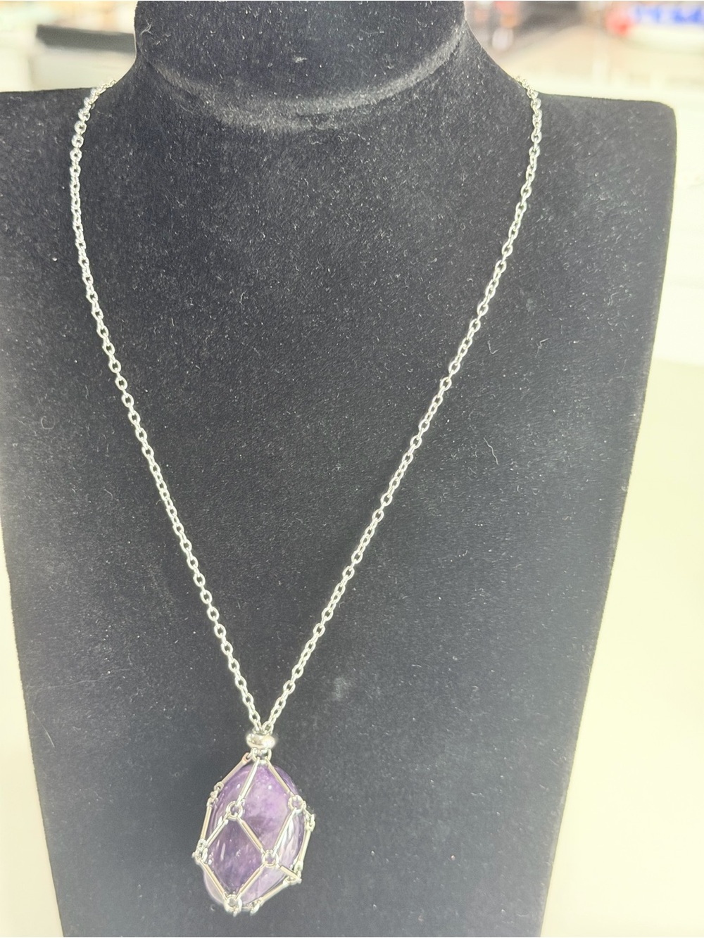 Interchangeable crystal cage necklace featuring a tumbled, natural amethyst